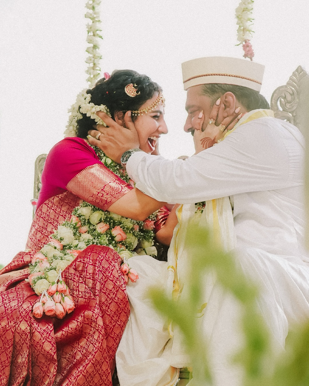 A newlywed couple sharing a joyful moment during their ceremony