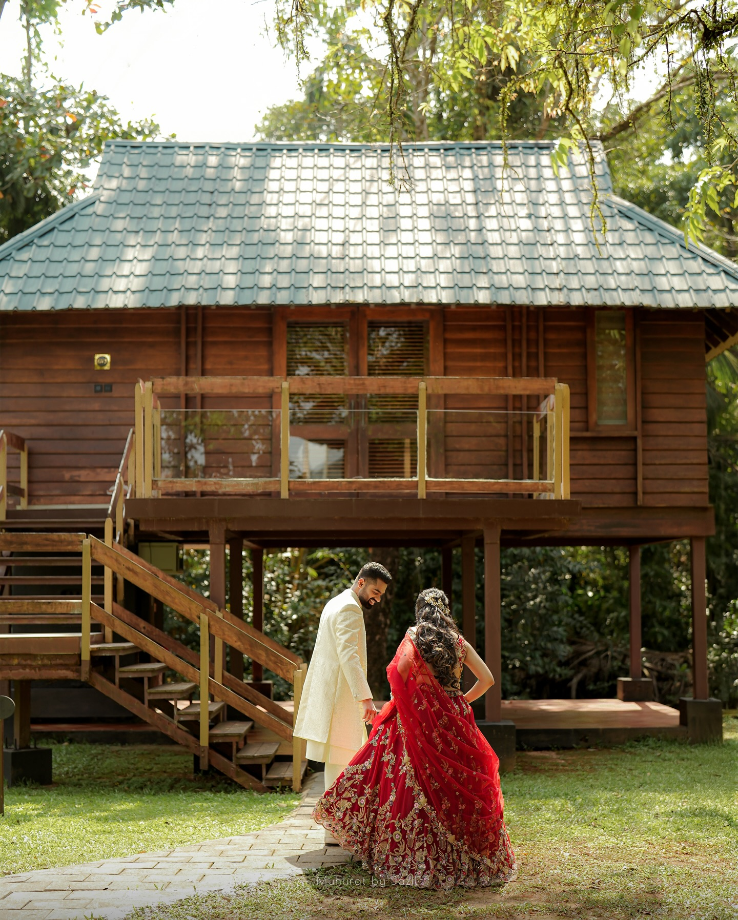 A couple walking together outside a timber retreat